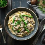 creamy mushroom and asparagus chicken penne served hot